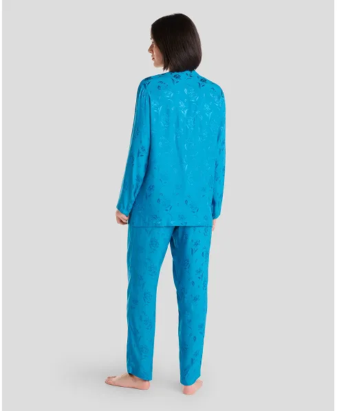 Rear view of a woman in blue jacquard pyjama bottoms