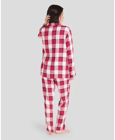 Rear view of woman in long red checked pyjamas