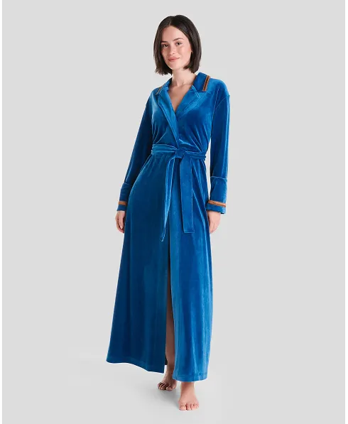 Woman in blue velvet dinner jacket collar long gown