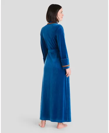 Rear view of blue long velvet women's winter coat