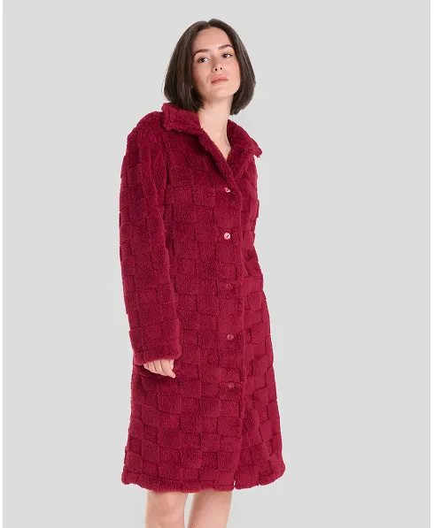 Woman in short red buttoned winter coat with side pockets.