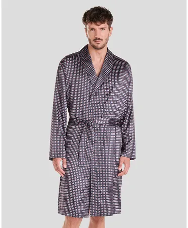 Man in short navy satin navy polka dot Christmas dressing gown