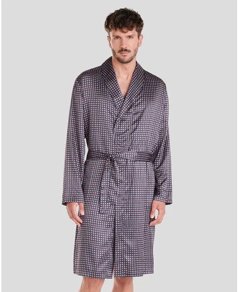 Man in short navy satin navy polka dot Christmas dressing gown