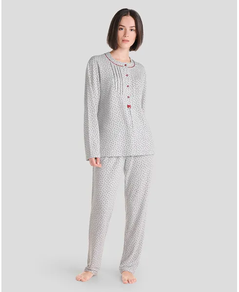 Woman in grey long winter pyjamas with closed collar with maroon flowers