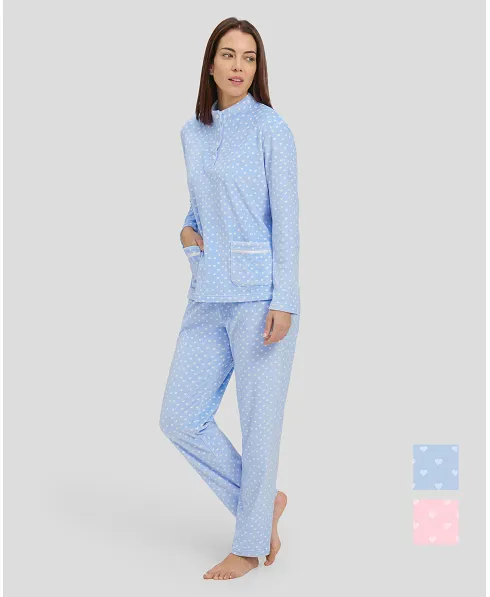 Woman in light blue winter pyjamas with little hearts