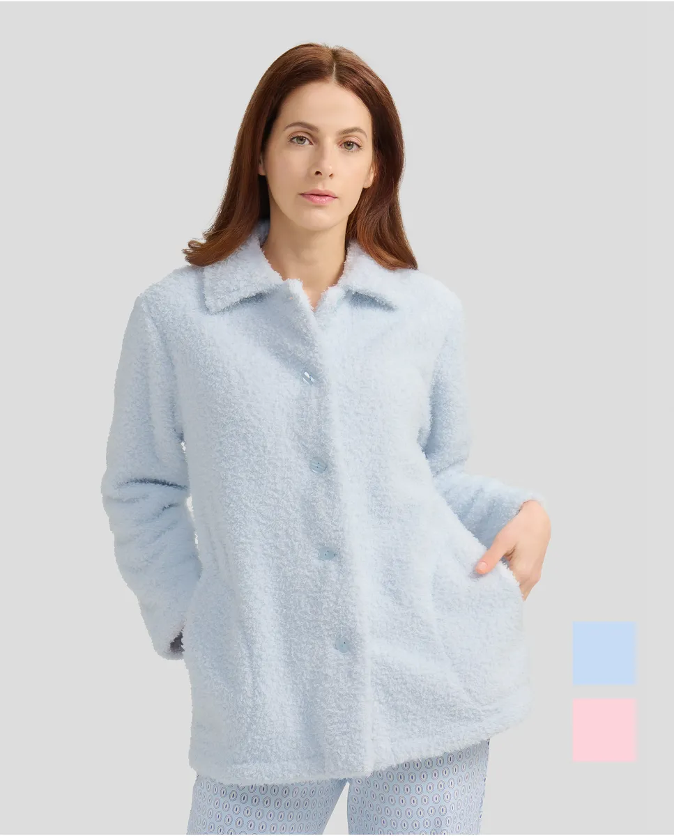 Woman with short light blue sheepskin coat with buttons and pockets