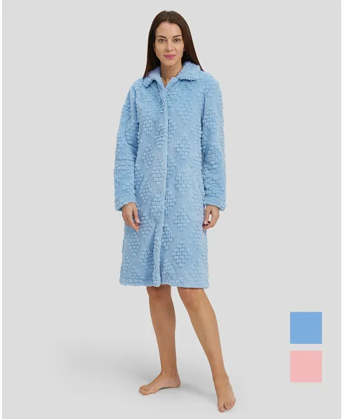 Woman in light blue jacquard long winter coat, buttoned and with pockets