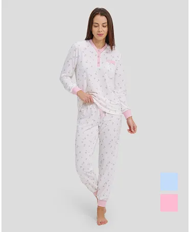 woman with long winter pyjamas with pink heart print