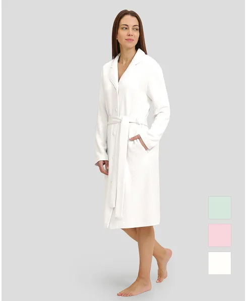 Woman in ivory winter long dressing gown with lapel collar, belt and long sleeves