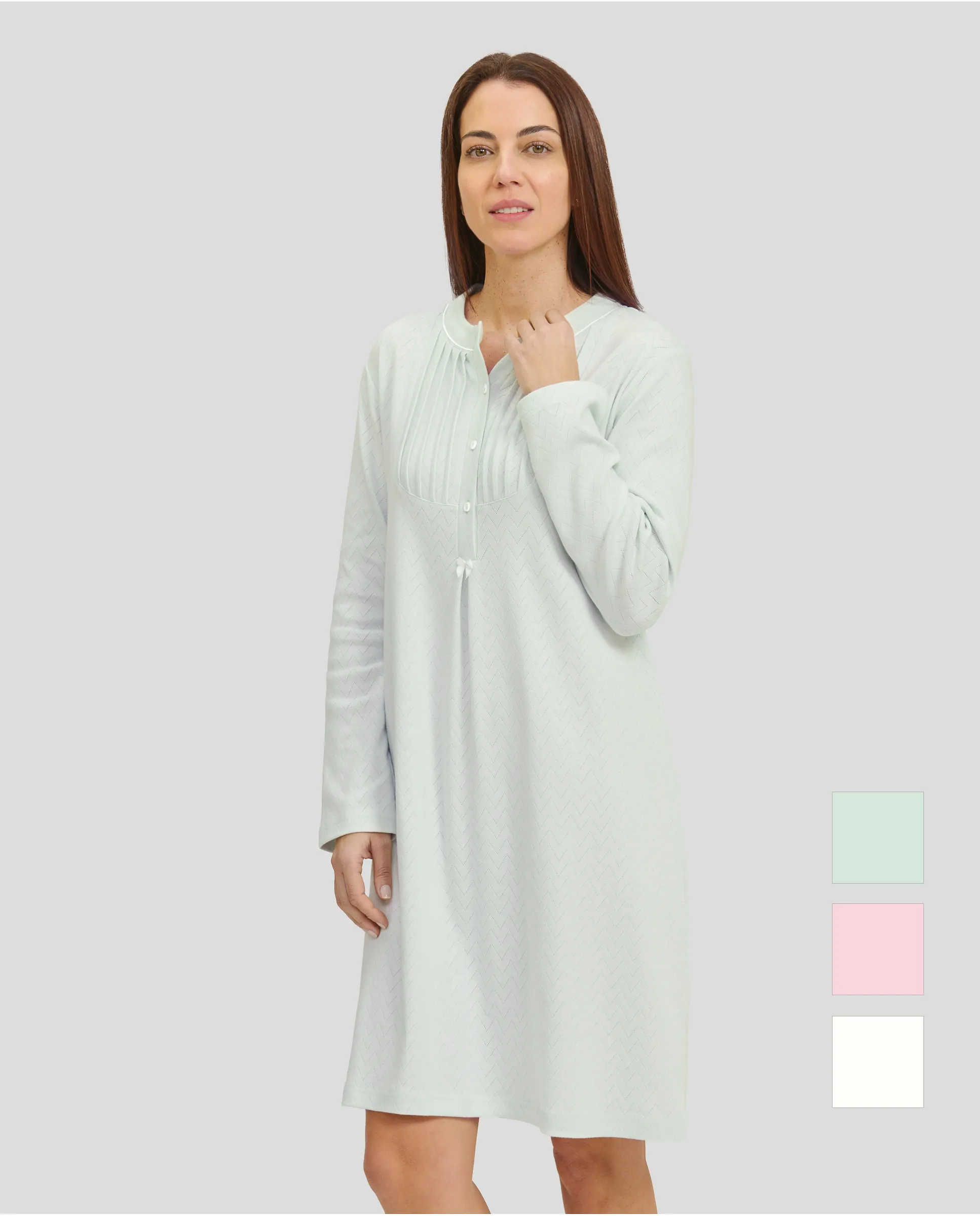 Woman in soft green long-sleeved nightgown for winter with louvers