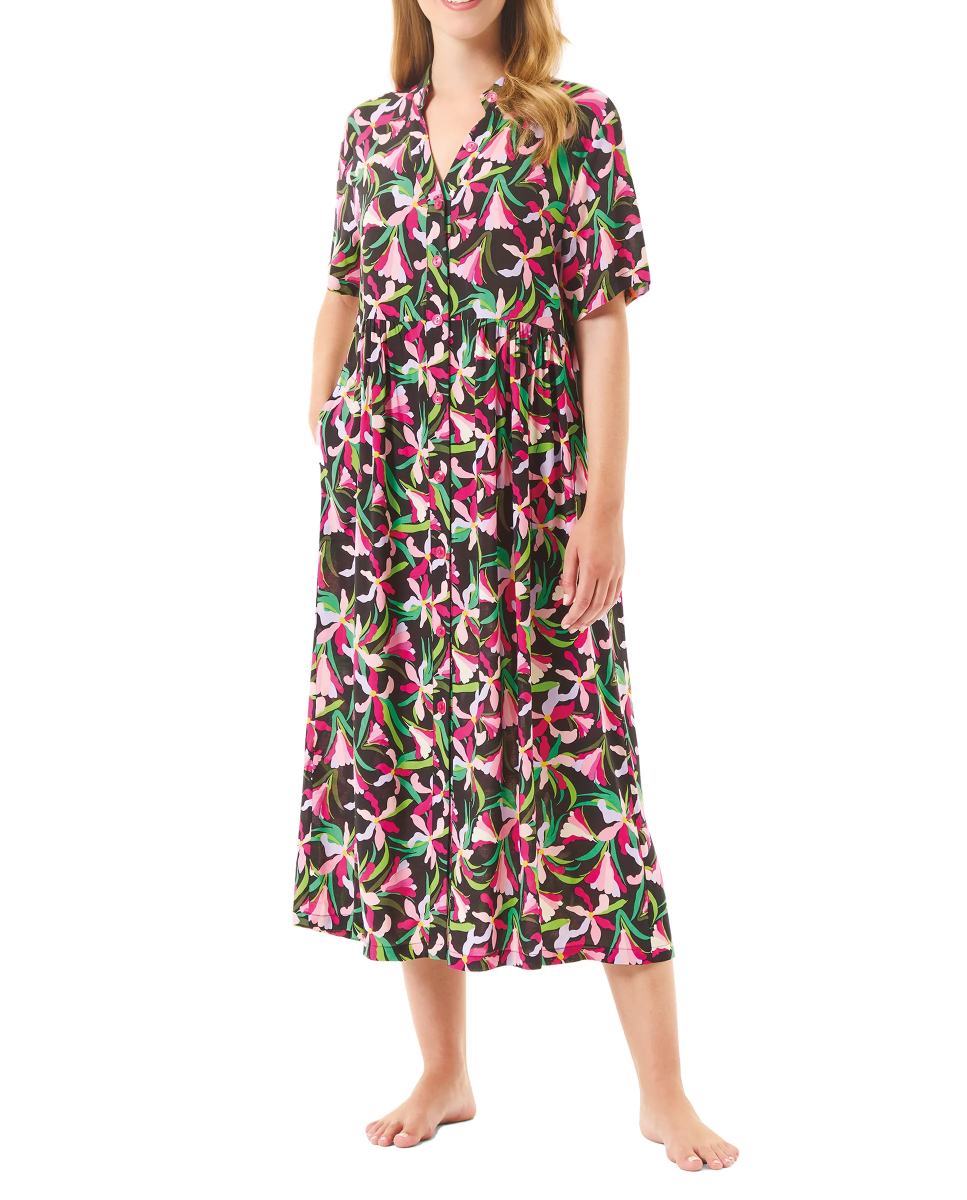 Woman in a long floral summer dress with open button fastening