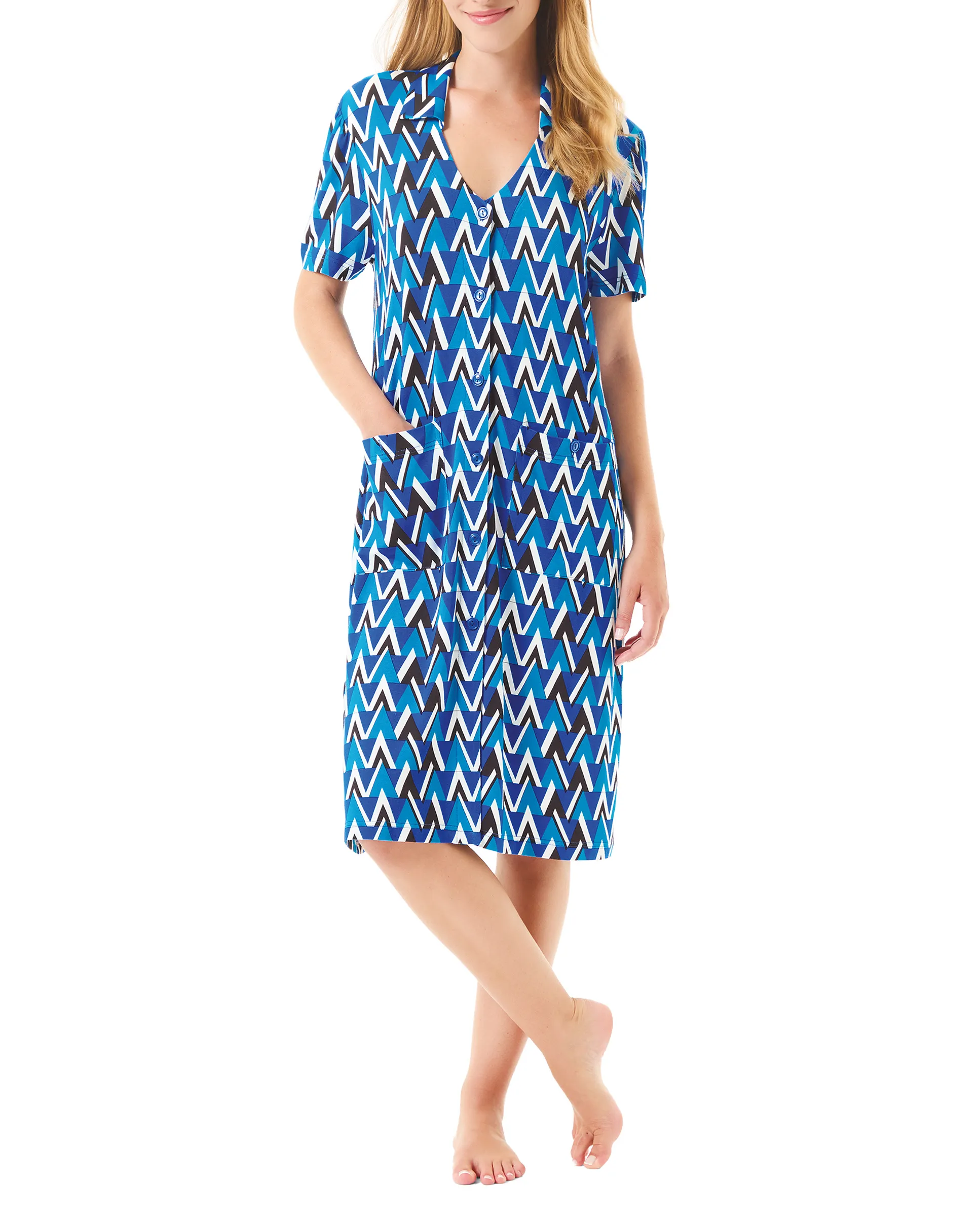 Woman wearing short summer dress with open short sleeves with buttons, geometric print