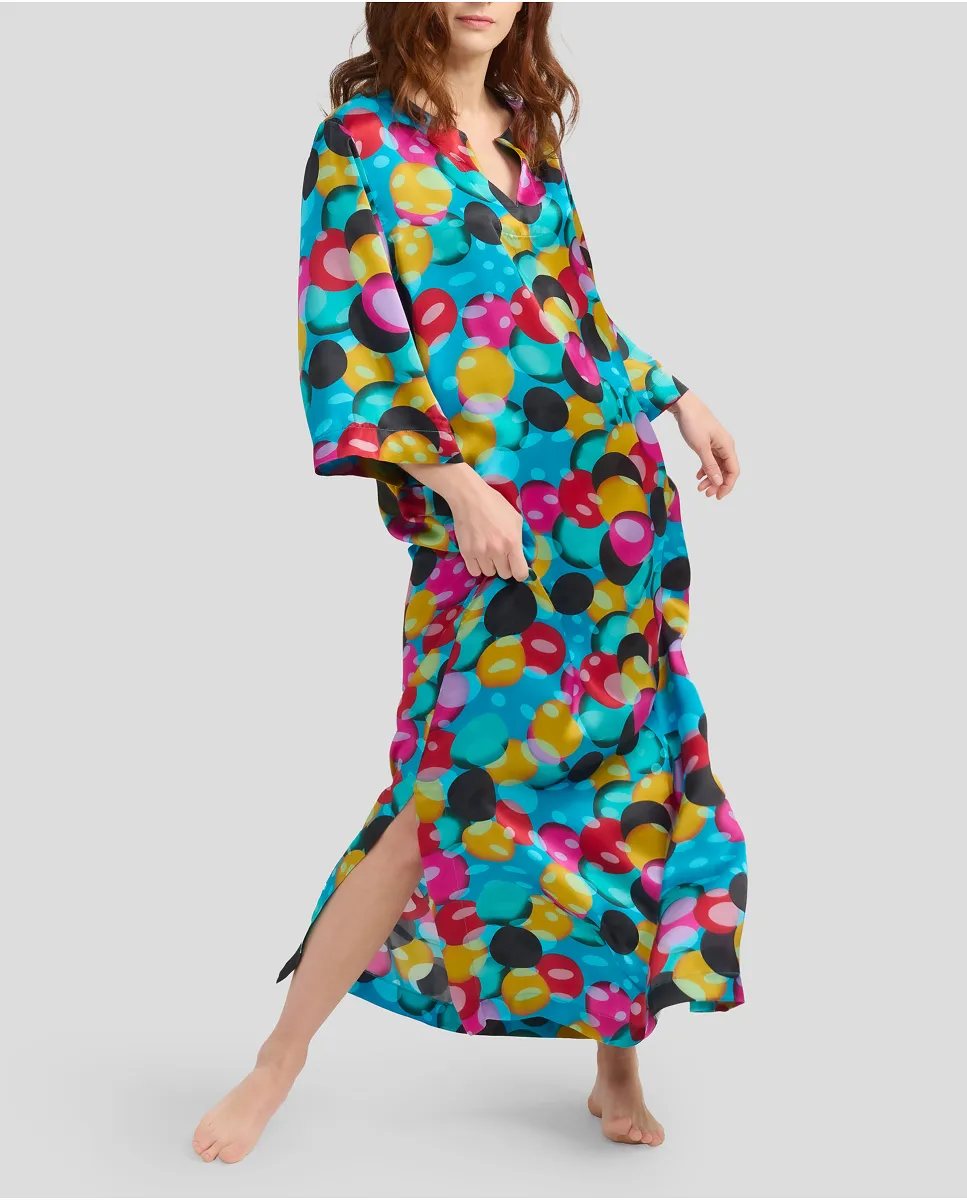 Woman with long summer kaftan in natural printed silk