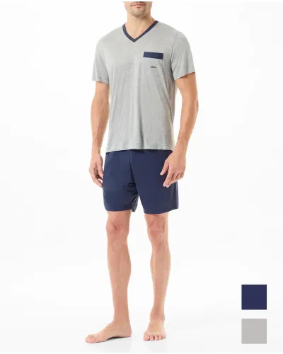 Man in summer pyjama shorts with grey v-neck t-shirt and navy shorts