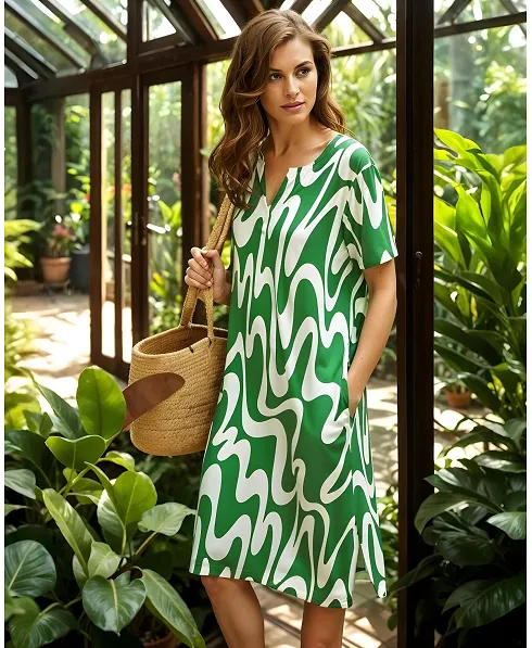 Woman shows off her summer dress with pockets and a beach bag