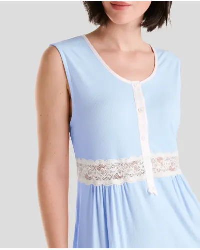 Detail of the light blue summer lingerie camisole with open neckline with satin leg and buttons and lace at the waist.