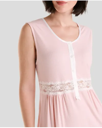 Detail of the pink summer lingerie camisole with open neckline with satin leg and buttons and lace waistband