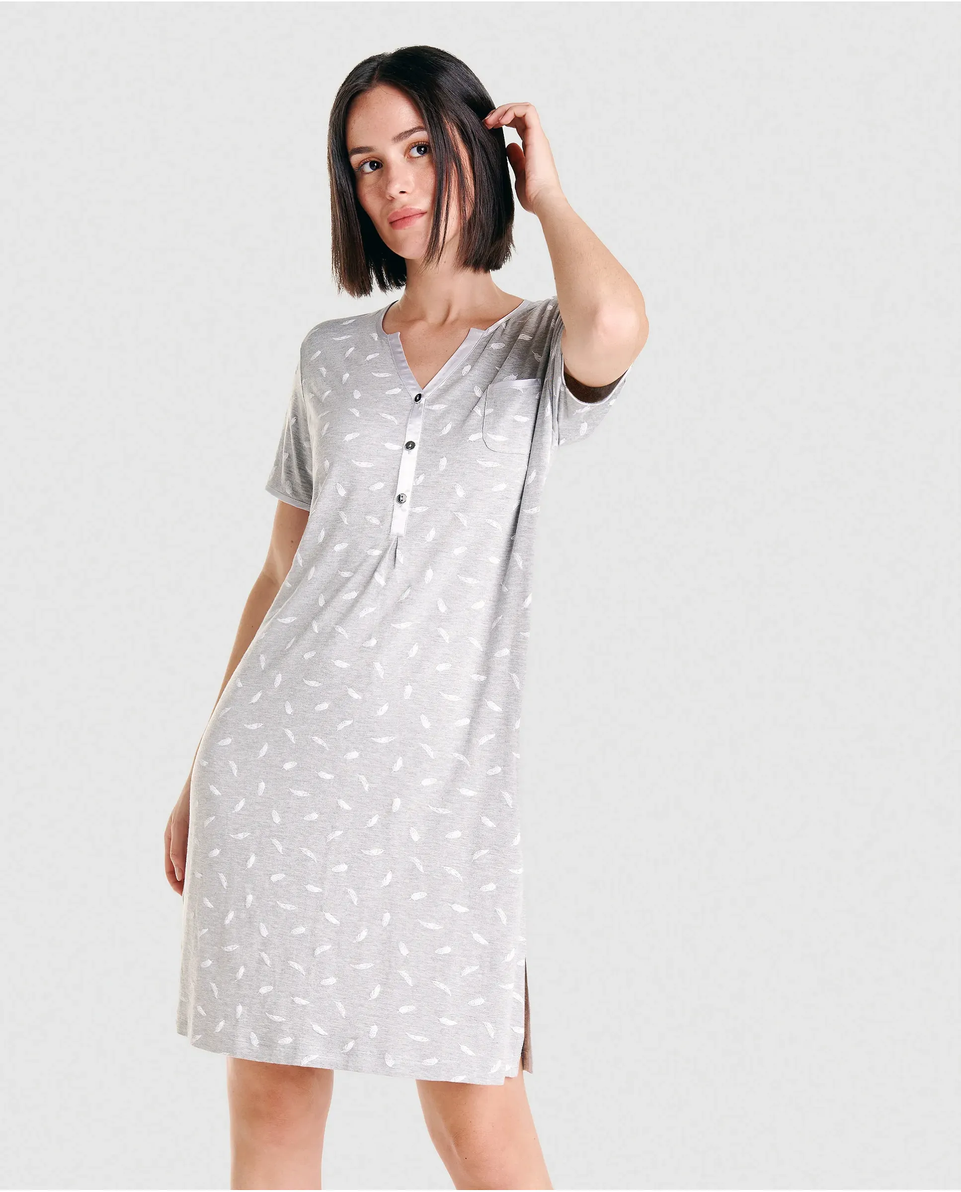 Grey short sleeved summer nightdress with buttons at the neckline and an elegant white feather print.