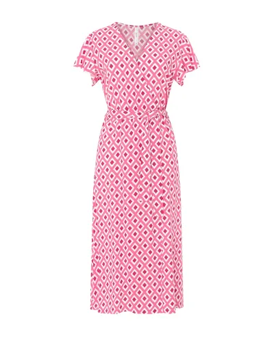 Model wears a short summer dress with crossover neckline and belt in a red diamond print.