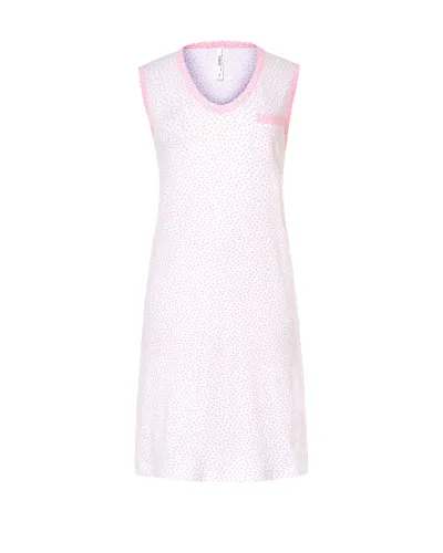 A woman with her back turned wears a light-coloured sleeveless summer camisole with delicate prints of light blue hearts.