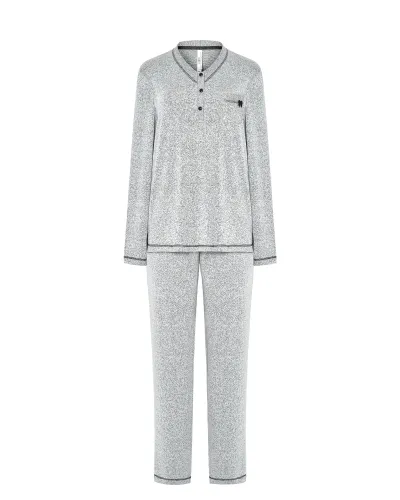 Woman wearing grey long-sleeved winter pyjamas with buttoned collar and pocket
