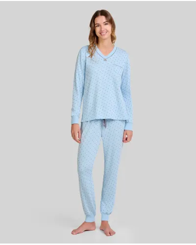 Woman wearing long-sleeved pyjamas for winter in sky blue with grey polka dots and decorative pocket