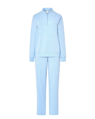 Woman wearing warm, long, sky blue pyjamas in a twill fabric with a small grey polka dot print.