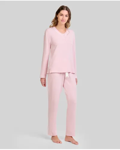 Woman wearing long pink melange winter pyjamas with a V-neck decorated with white trim