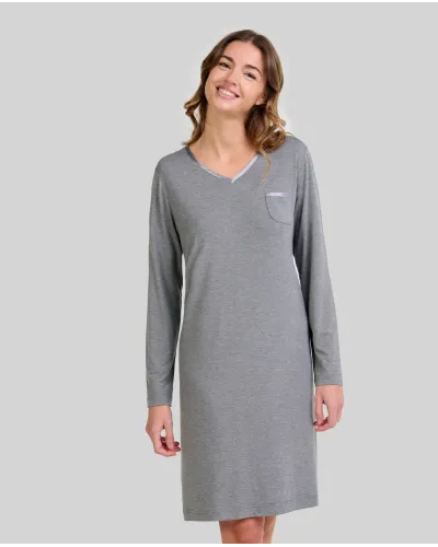 Woman wearing an elegant grey modal long-sleeved nightdress with a V-neckline and satin trim.