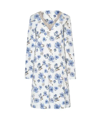 Woman wearing a long-sleeved winter nightgown with blue flowers and lace at the neckline