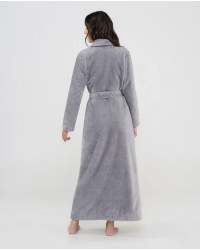 Woman wearing a long grey jacquard robe with buttons, belt and side pockets
