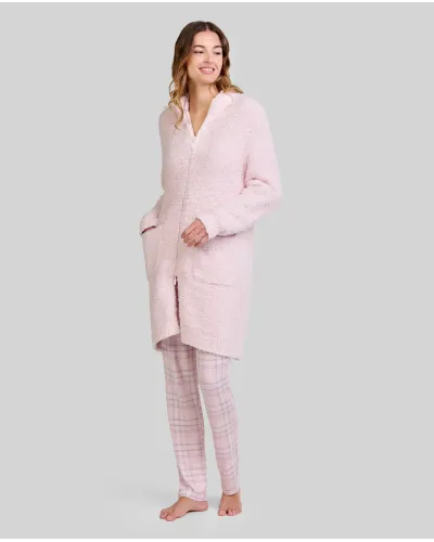 Woman wearing a light pink long dressing gown with a zip and pockets and pink checked pyjama trousers