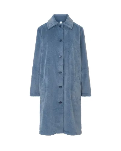 Woman wearing a long, buttoned winter coat in Pacific blue jacquard