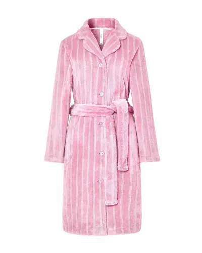 Woman wearing a pink jacquard wrap-around robe with stripes, pockets and a belt.