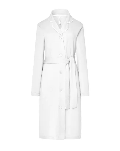 Woman wearing a long ivory lace robe with buttons and a belt