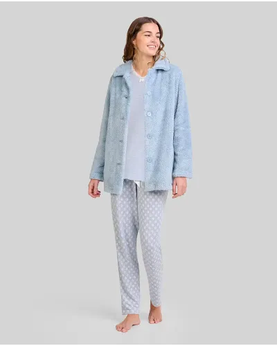 Woman wearing blue leaf-patterned pyjamas and winter dressing gown