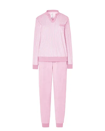Woman wearing comfortable light pink microfleece pyjamas with a striped T-shirt and plain trousers