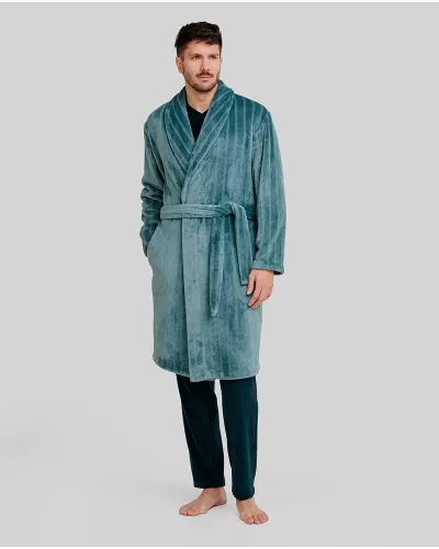 Man wearing a long jacquard robe with green stripes, tuxedo collar, side pockets and belt