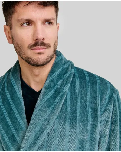 Man wearing a long jacquard robe with green stripes, tuxedo collar, side pockets and belt