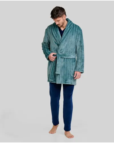 Man wearing a short green striped Jacquard dressing gown with a tuxedo collar, side pockets and a belt.