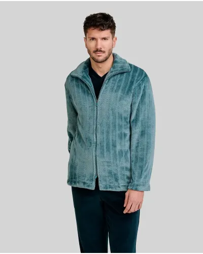 Man wearing a short green jacquard winter coat with stripes and side pockets