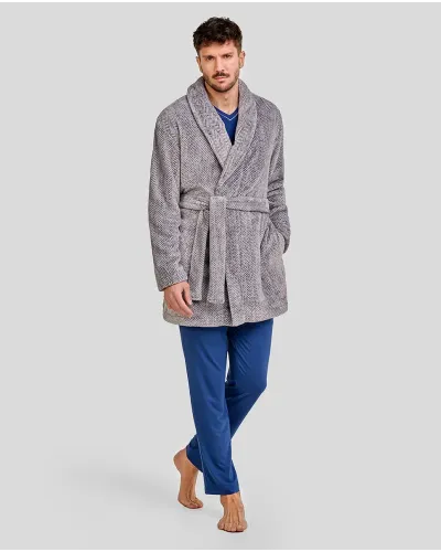 Man wearing a grey herringbone-textured dressing gown with a tuxedo collar and belt