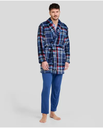 Man wearing a short blue, red and white checked dressing gown with a belt and blue pyjamas