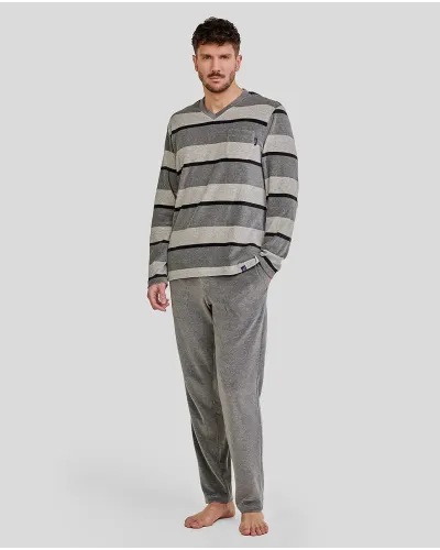Man wearing comfortable long grey velvet striped winter pyjamas
