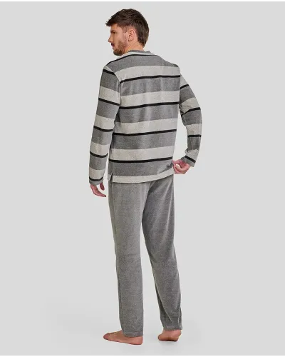 Man wearing comfortable long grey velvet striped winter pyjamas