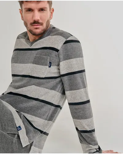 Man wearing comfortable long grey velvet striped winter pyjamas
