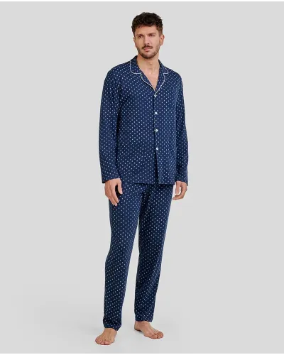 Man wearing long navy blue winter pyjama shirt with paisley print and pockets