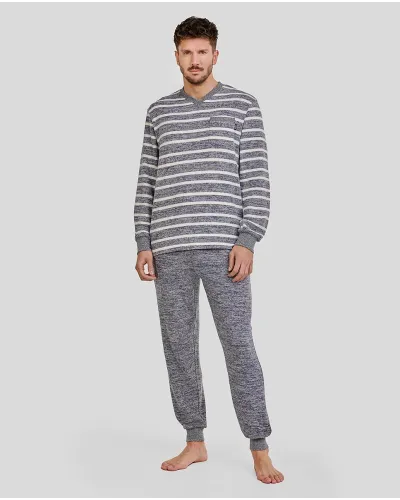 Man wearing comfortable long winter pyjamas in a blue melange stripe pattern