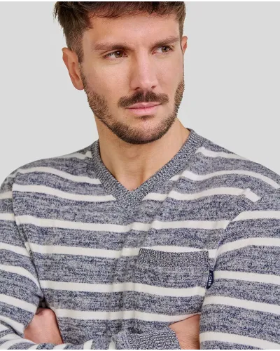 Man wearing comfortable long winter pyjamas in a blue melange stripe pattern