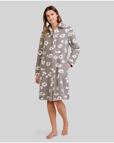 Woman wears knee-length grey fleece robe with white animal patterns and two pockets
